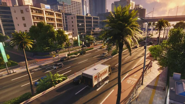 An ANANTA city street with palm trees, traffic and long evening shadows.